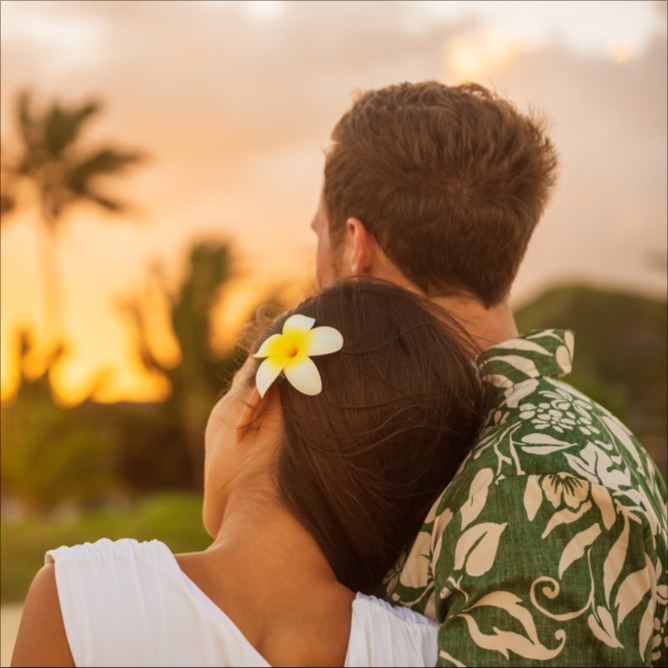 young couple watching sunset